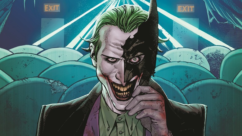 The real Joker, holding a piece of Batman's mask.
