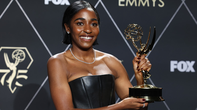 Ayo Edebiri holds Emmy award