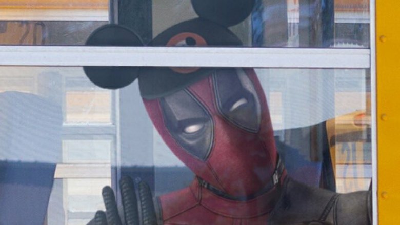 Deadpool wearing Mickey Mouse ears Disney Fox merger