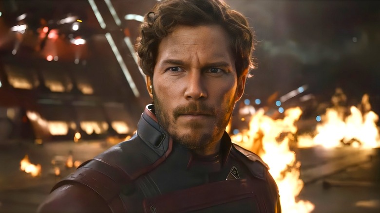 Star Lord standing in front of flames