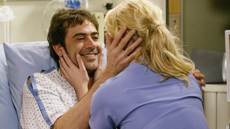 Denny and Izzie about to kiss