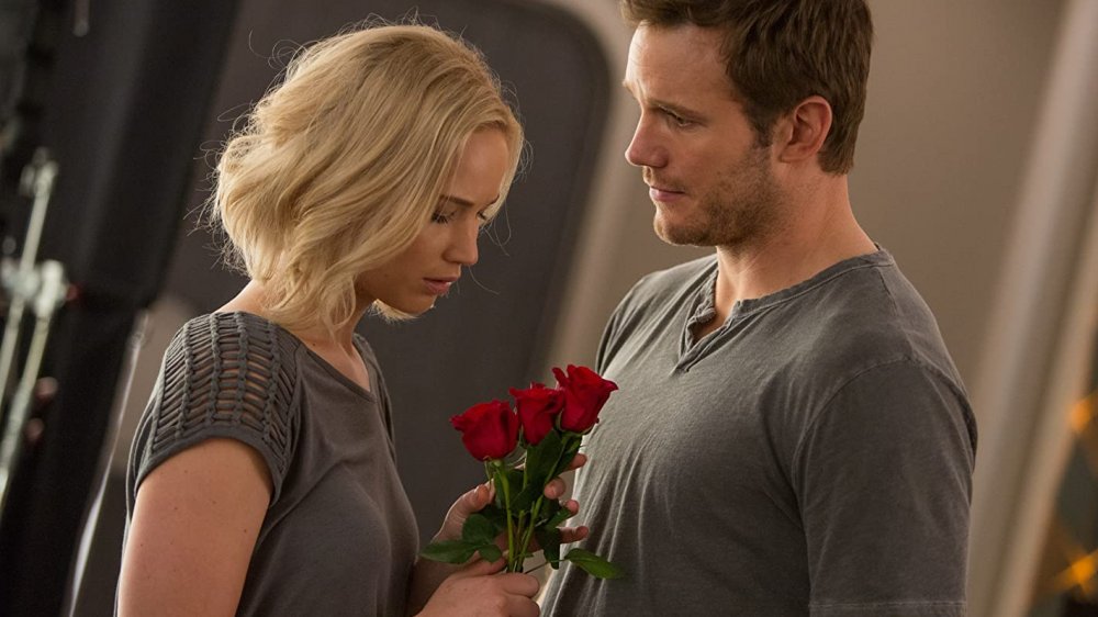Jennifer Lawrence as Aurora Lane looks down at red roses from Chris Pratt as Jim Preston in Passengers