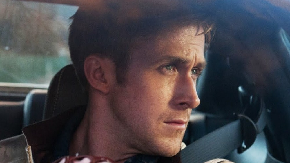 Ryan Gosling as Driver looks out his car window