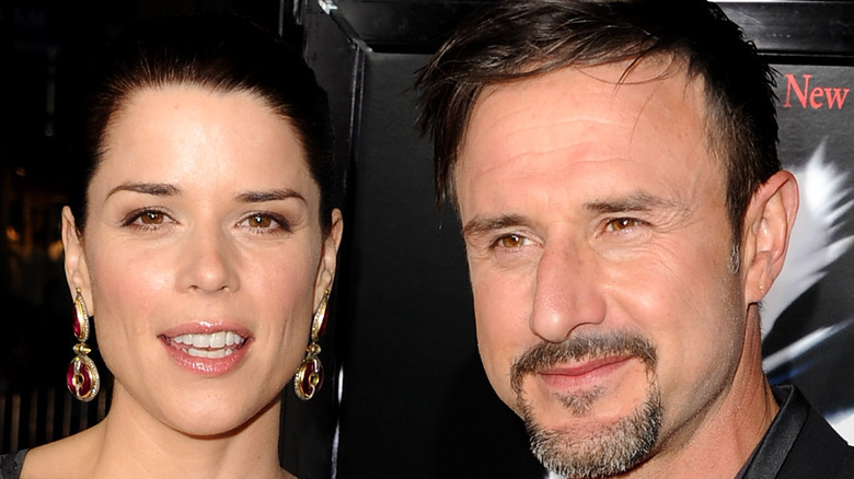 Neve Campbell and David Arquette posing