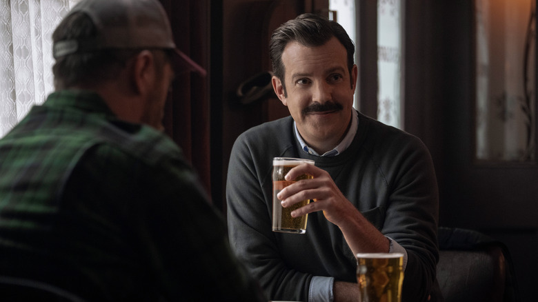 Ted Lasso drinking a pint with Coach Beard