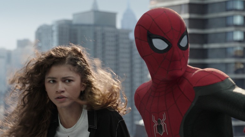 Michelle Jones-Watson looks concerned as Spider-Man steadies her arm
