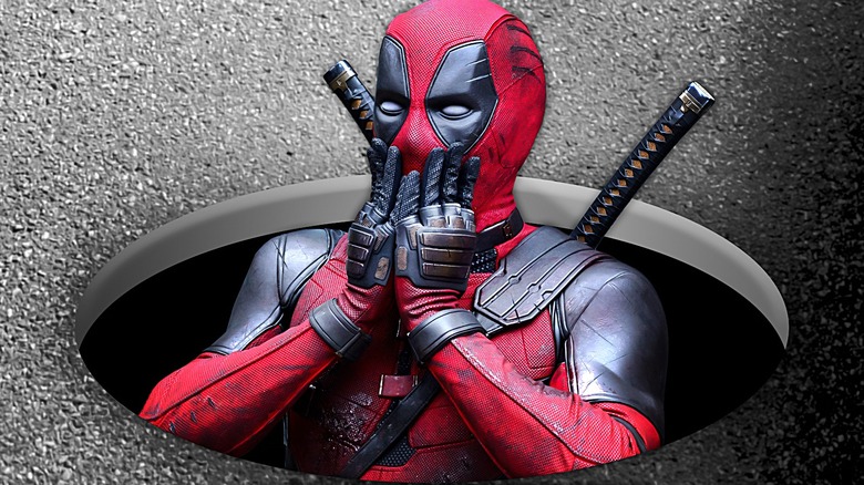 Deadpool sinking into hole and looking confused