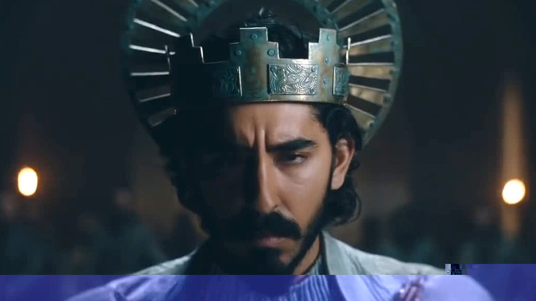 Dev Patel as Gawain wearing crown in The Green Knight