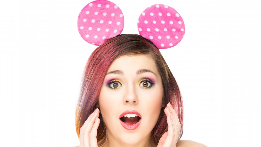 Surprised model wearing Mickey Mouse ears