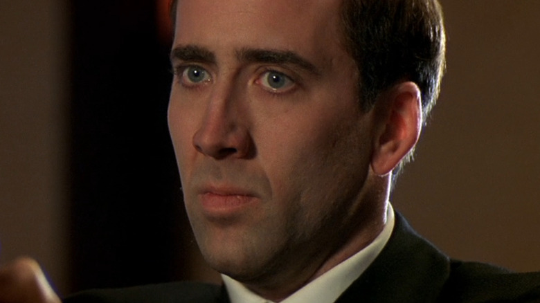 Nicolas Cage as Castor Troy in priest garb
