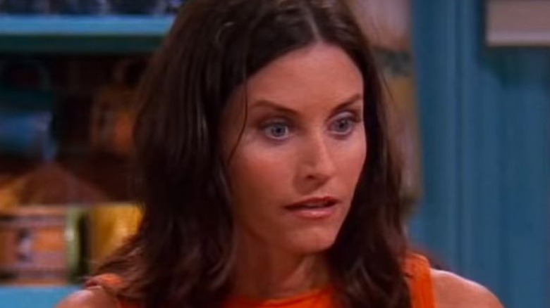 Courteney Cox playing Monica in Friends