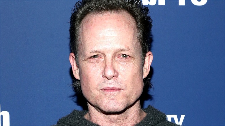 Dean Winters looking at the camera
