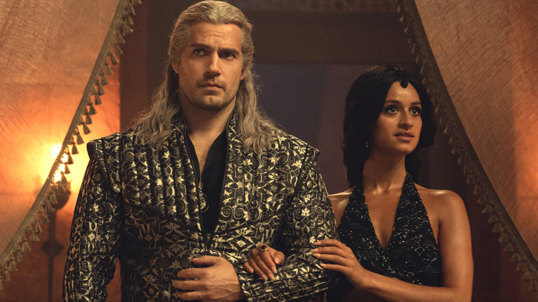 Geralt stands with Yennefer