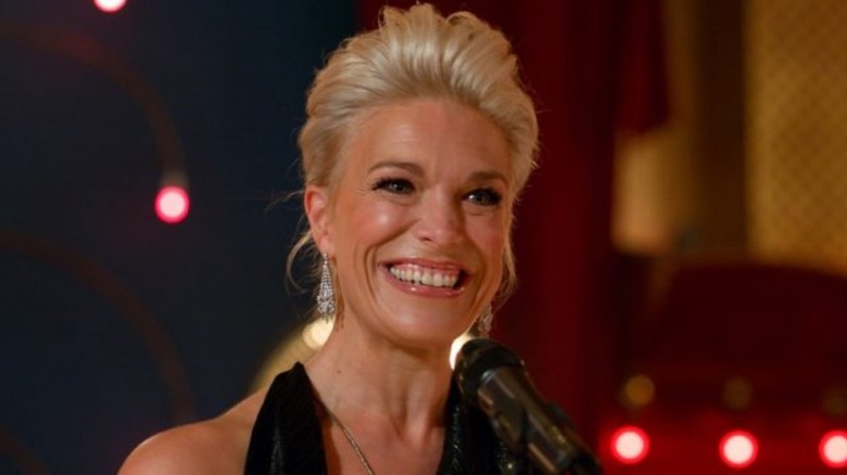 Hannah Waddingham as Rebecca at mic in Ted Lasso