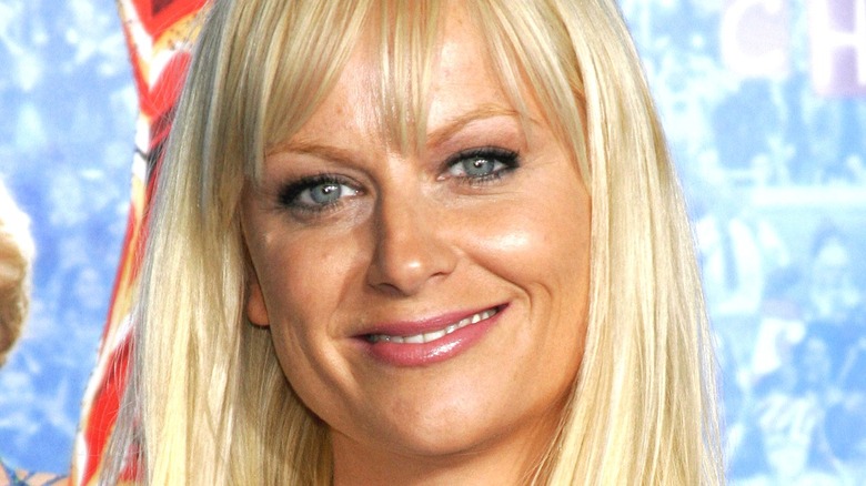 Amy Poehler wears bangs and smiles