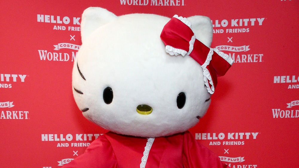 An actress dressed as Hello Kitty poses at a Cost Plus World Market event