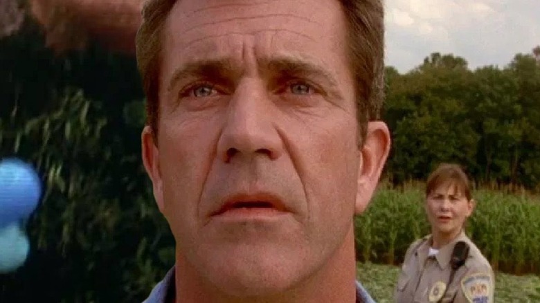 Mel Gibson growing concerned in a cornfield