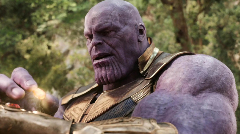 Thanos putting Infinity Stone gauntlet