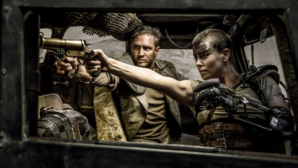 Charlize Theron as Furiosa and Tom Hardy as Max in Mad Max: Fury Road