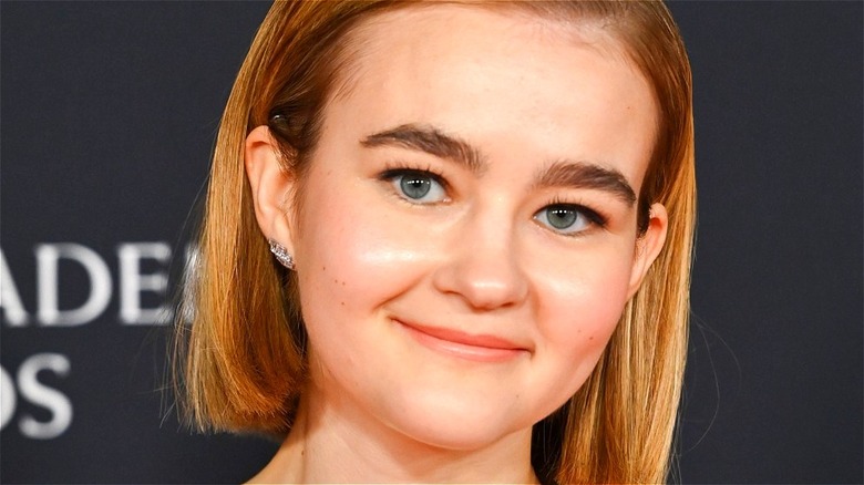 Millicent Simmonds smiling on the red carpet