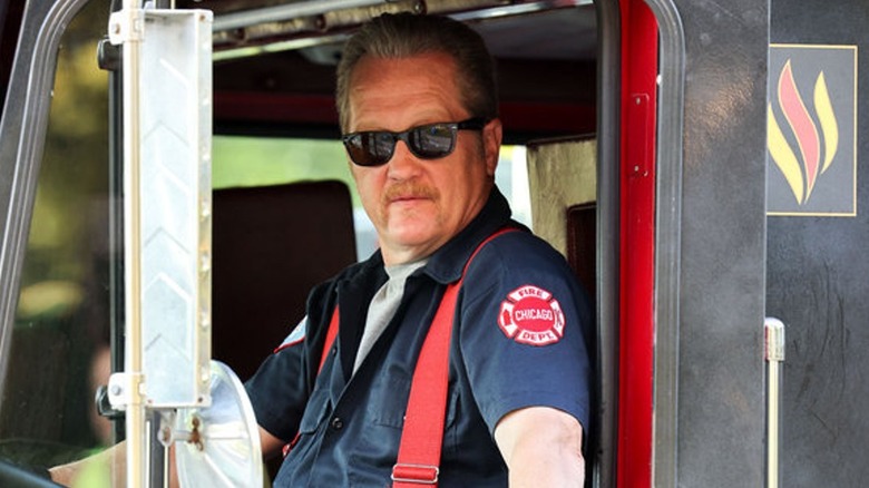 Mouch McHolland driving a fire engine