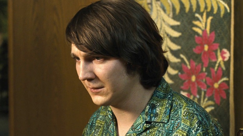 Brian Wilson sits in patterned shirt 