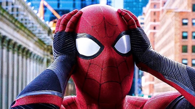 Spider-Man holding head in shock