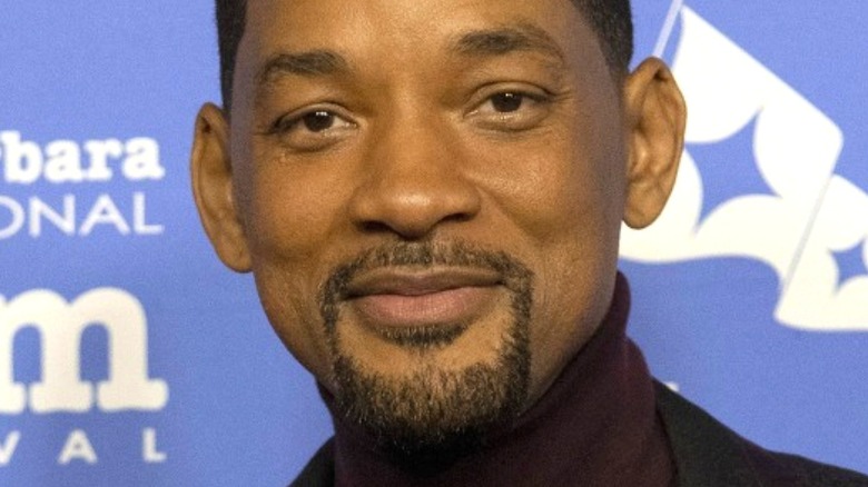 Will Smith smiling for red carpet photos